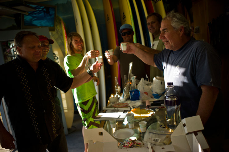 Terry Senate clinks glasses with his friends on his birthday at his surf shop in San Clemente, Calif., May 2, 2011.